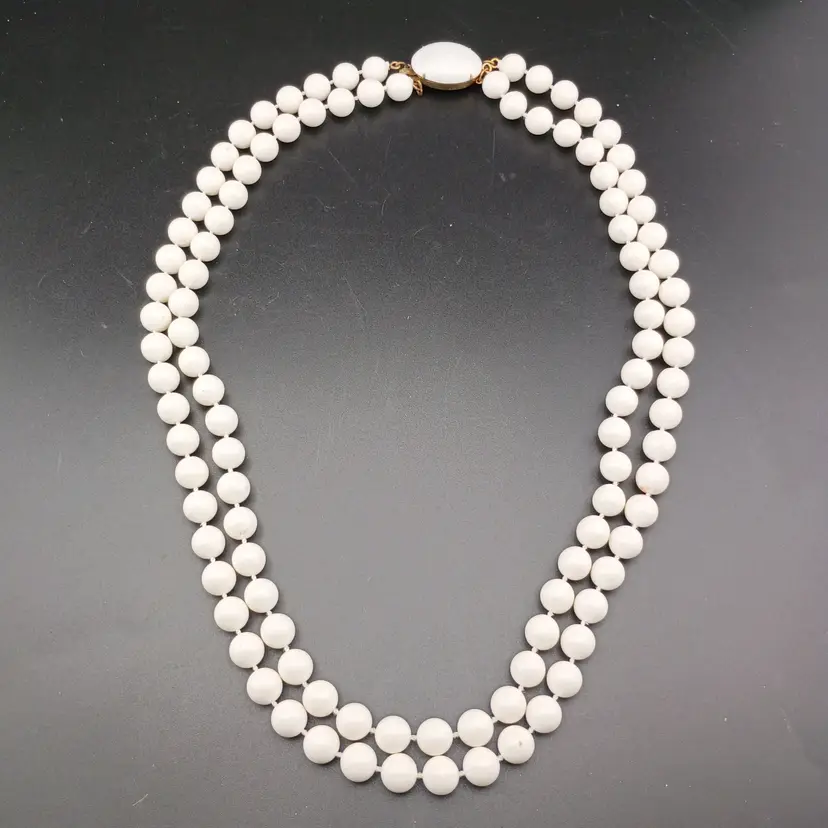 Double strand plastic pearls