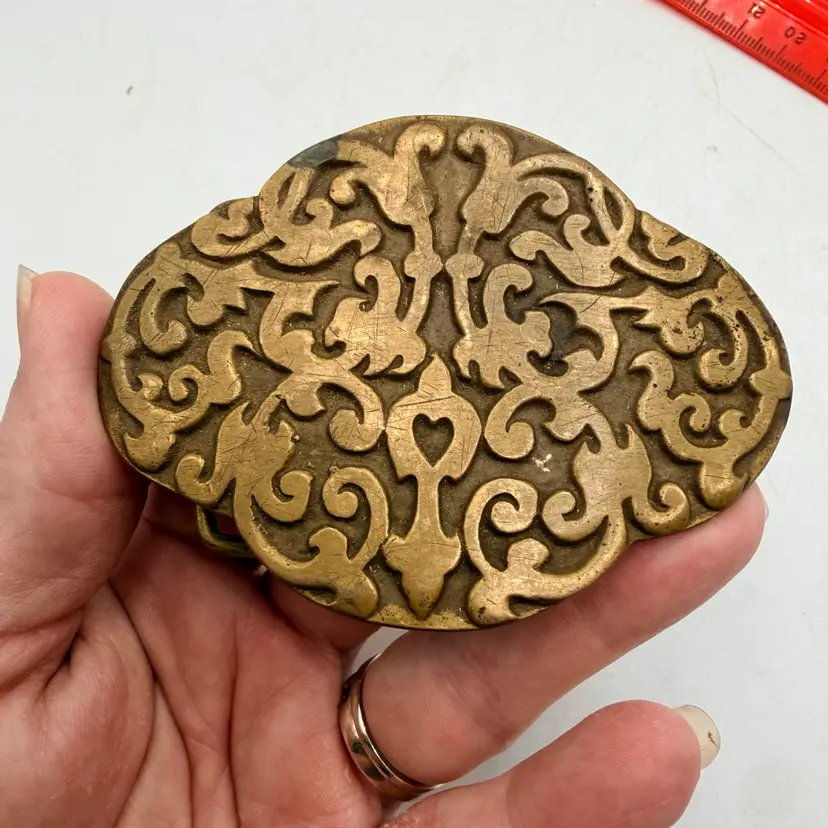 Vintage 1970s solid brass belt buckle ornate symmetrical scroll swirl floral 70s