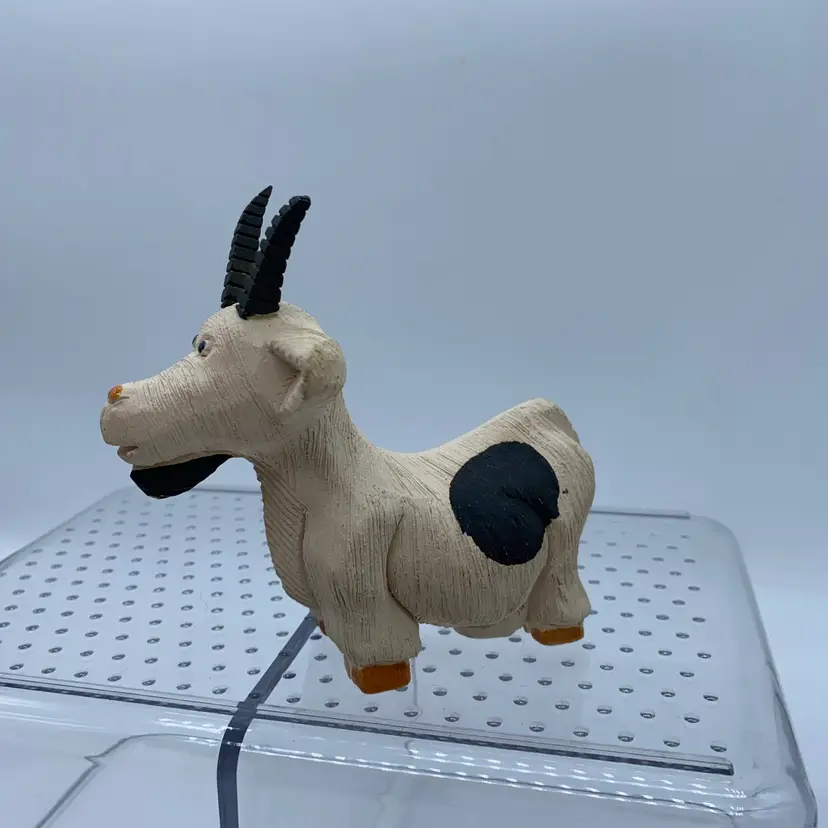 #3005 A vintage hand-carved earthenware goat figurine by Artesania Rinconada.