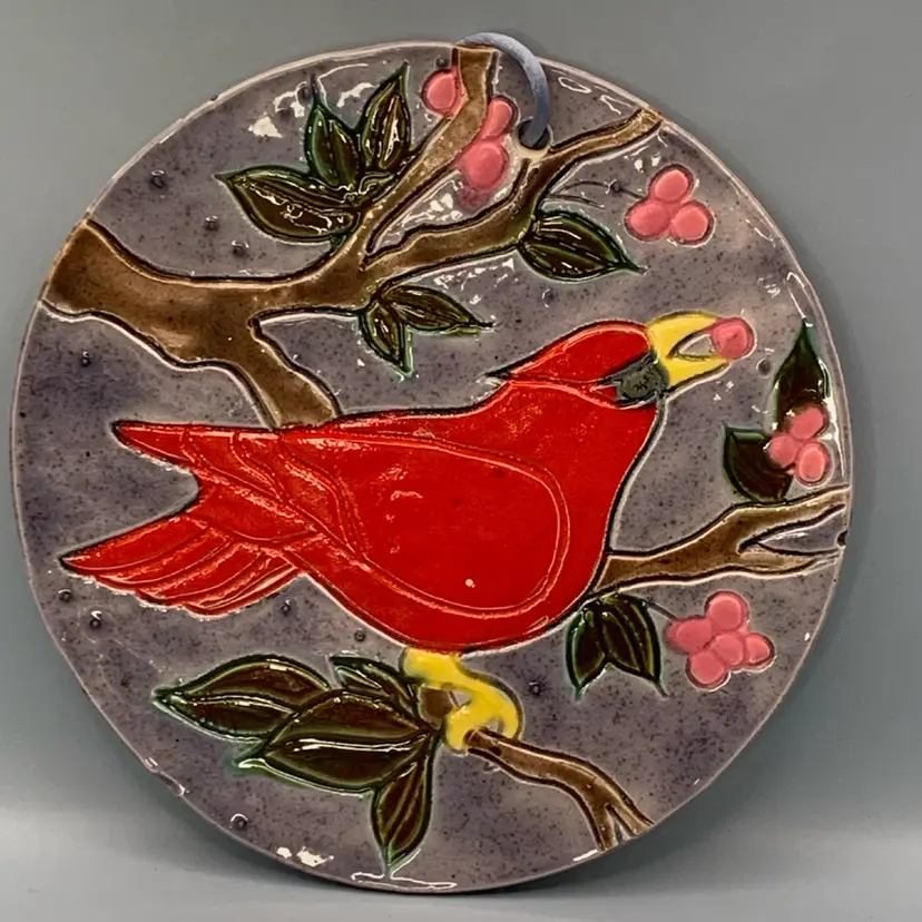 Handmade ceramic cardinal wall hanging round hand painted glaze.