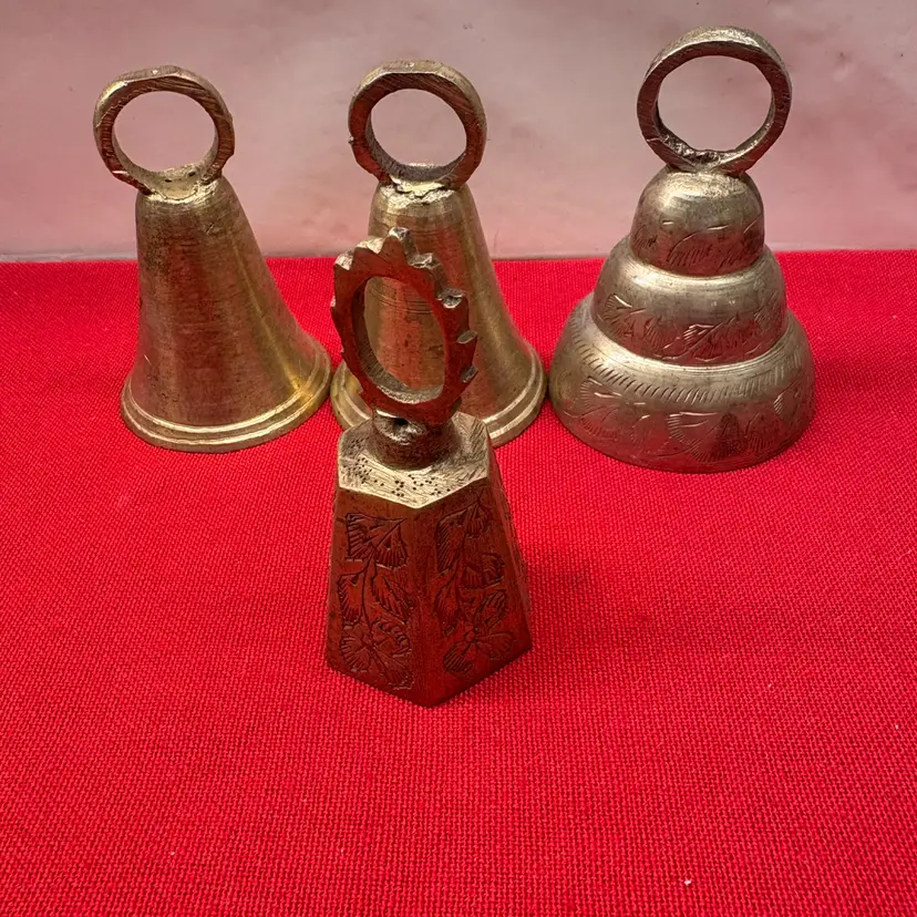 Collection of 4 vintage solid brass bells from India.