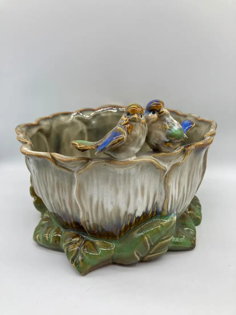Ceramic Petal planter body, leafy base, and two sweet birds perched on rim, brown, green and blue accents.