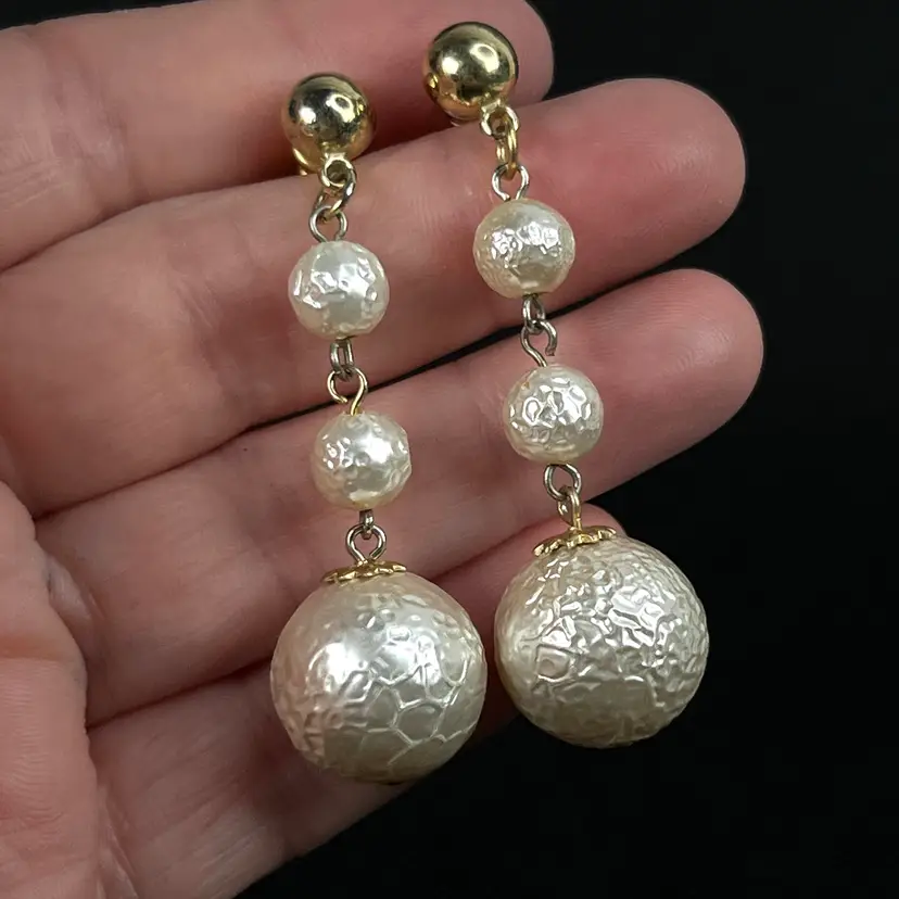Triple Pearlescent Ball Drop Pierced Earrings. Gold-tone Metal. 2-1/4” Length.