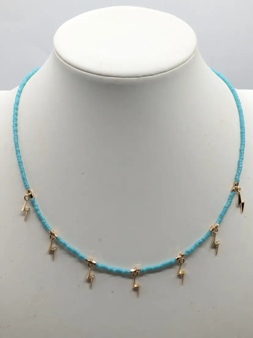 And Lovely Turquoise Color Beaded Necklace with Gold Tone Lightning Charms NWT