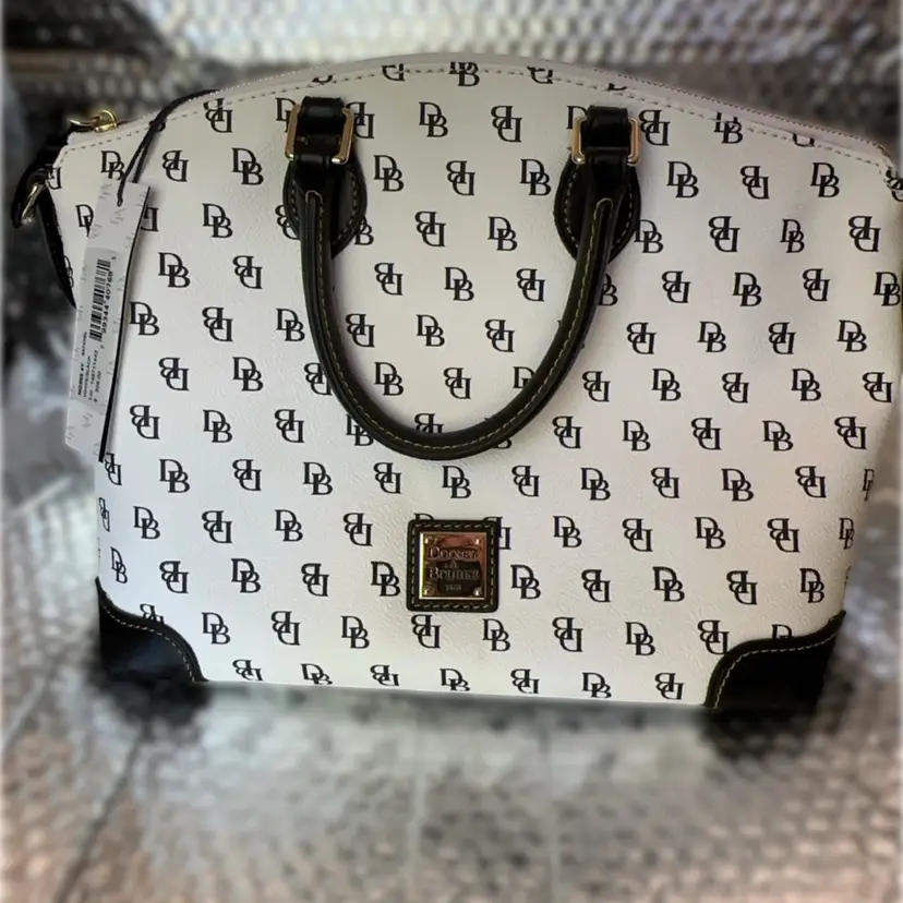 Dooney And Bourne - Brand new - Original  White with Black DB and Black Trim with  Classic Red Interior, In Original Blue Dust Bag. Zip Top Satchel. Has 14”zipper Standing  9.5” Tall And Sits 7.5”x12” Footprint