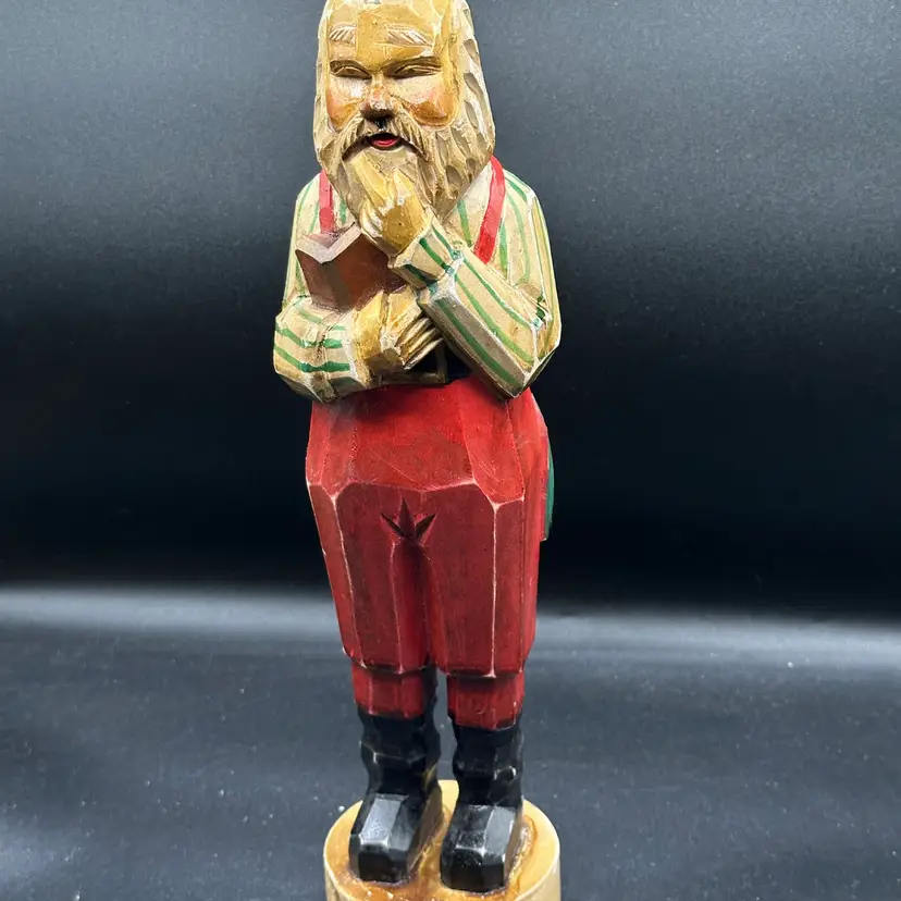 Hand Carved Wooden Santa For Christmas In A Thinking Pose