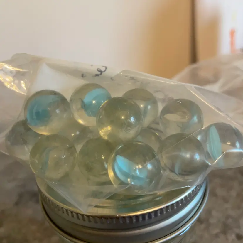 14 Clear Cat’s Eye Marbles With Lt. blue Veins