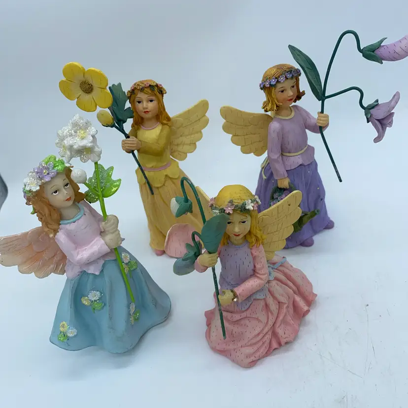 #1479 This is a set of four vintage resin Wildflower Angel figurines by Kathy Killip for Demdaco.