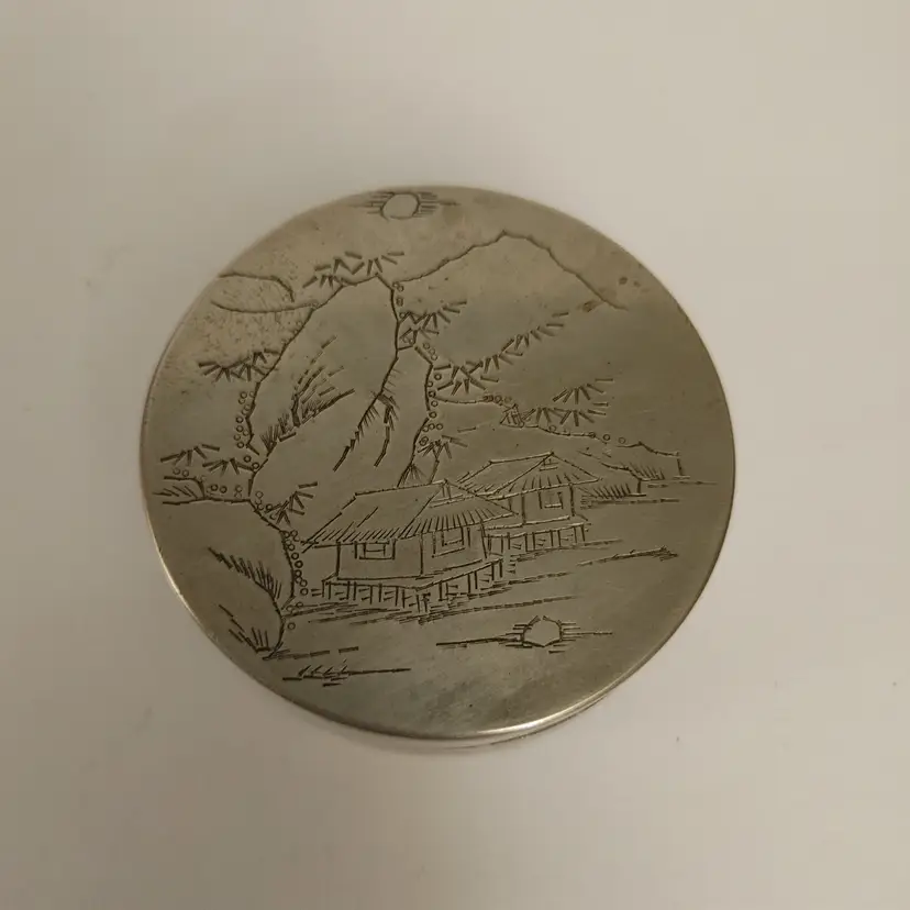 Engraved silver container. Asian. Has hallmark on bottom and writing on the inside. Possibly Qing Dynasty 1644-1911. 2.5 inch diameter. Good condition. Feel free to reach out to me if you have more info or have questions.