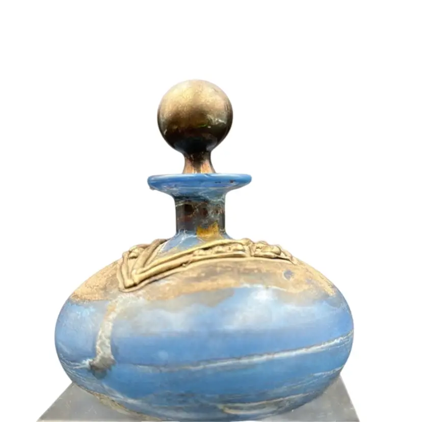 Perfume Bottle With Stopper, Blue Tone With Silver In Tone Accent. Possibly made in Israel has no makers Mark. could not find it anything like it rare peace.