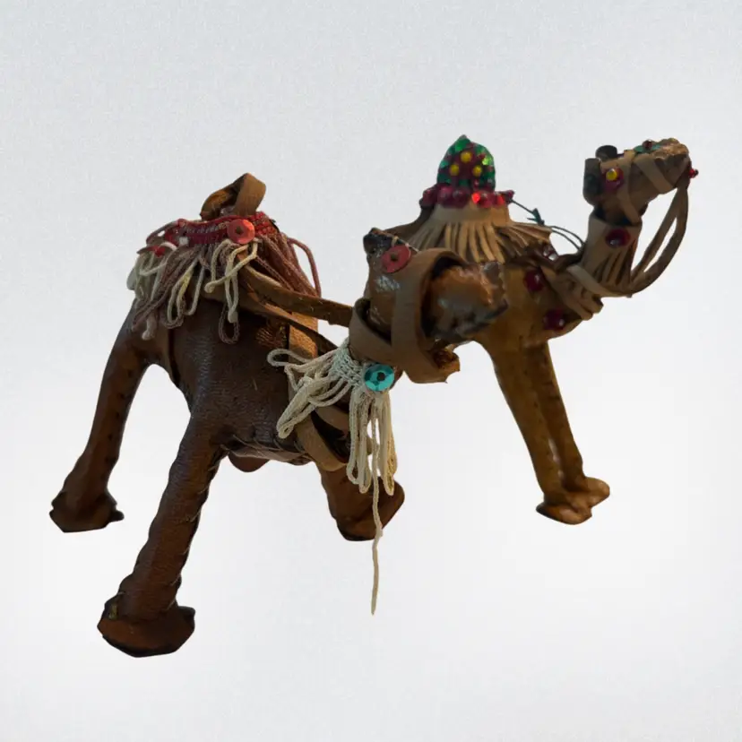 handcrafted decorative leather camel figurines featuring traditional folk art stitching