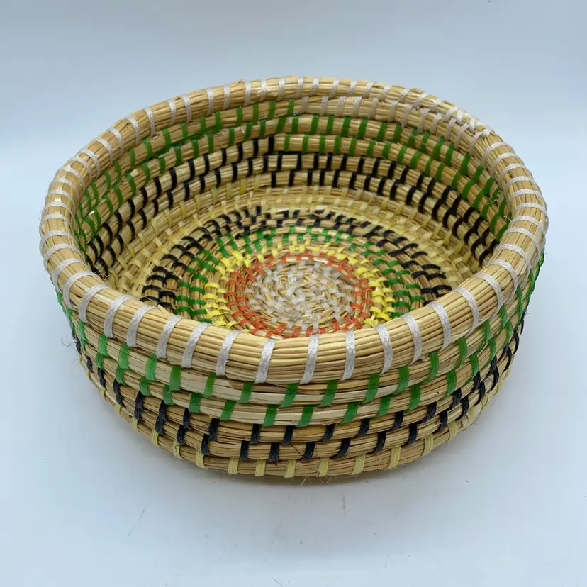 #4402 Handcrafted woven basket with colorful concentric pattern and natural fibers.