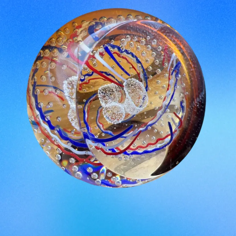 A vintage Caithness Glass commemorative paperweight, likely created for a Golden Jubilee (such as Queen Elizabeth II's 1952–2002 Golden Jubilee), featuring a red, white, and blue swirl design with controlled bubbles and a central "50" motif. Signed And Numbered Perfect Condition