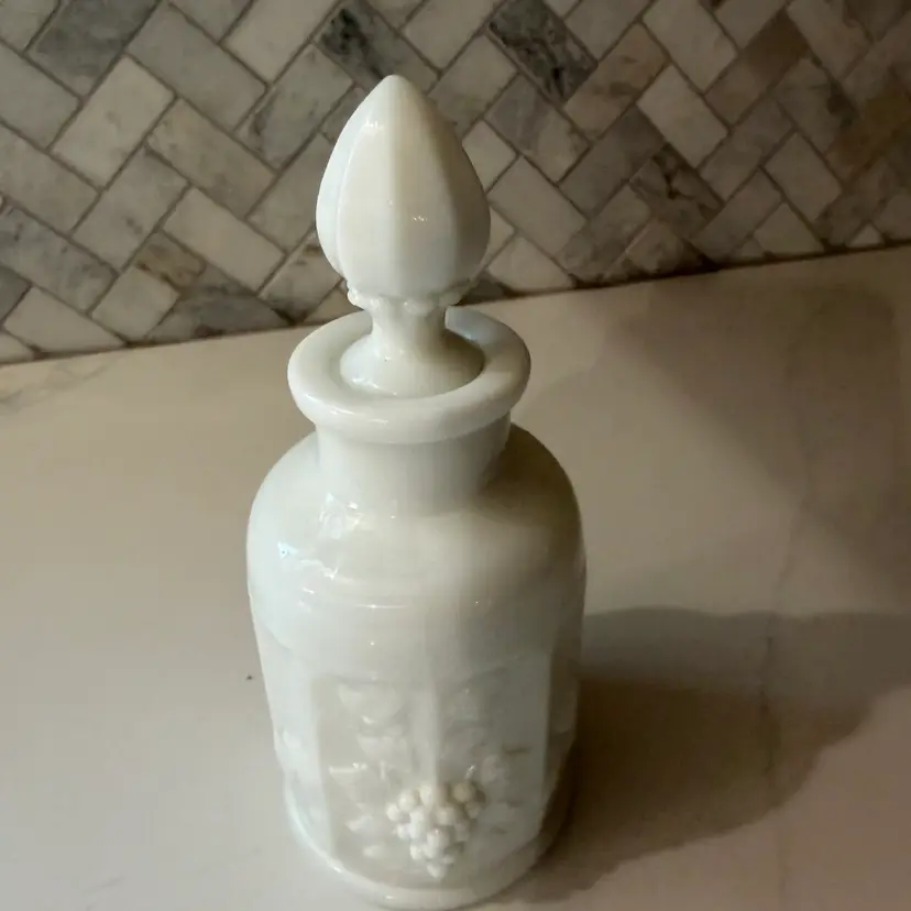 Westmoreland milk glass paneled grape cologne bottle with stopper.