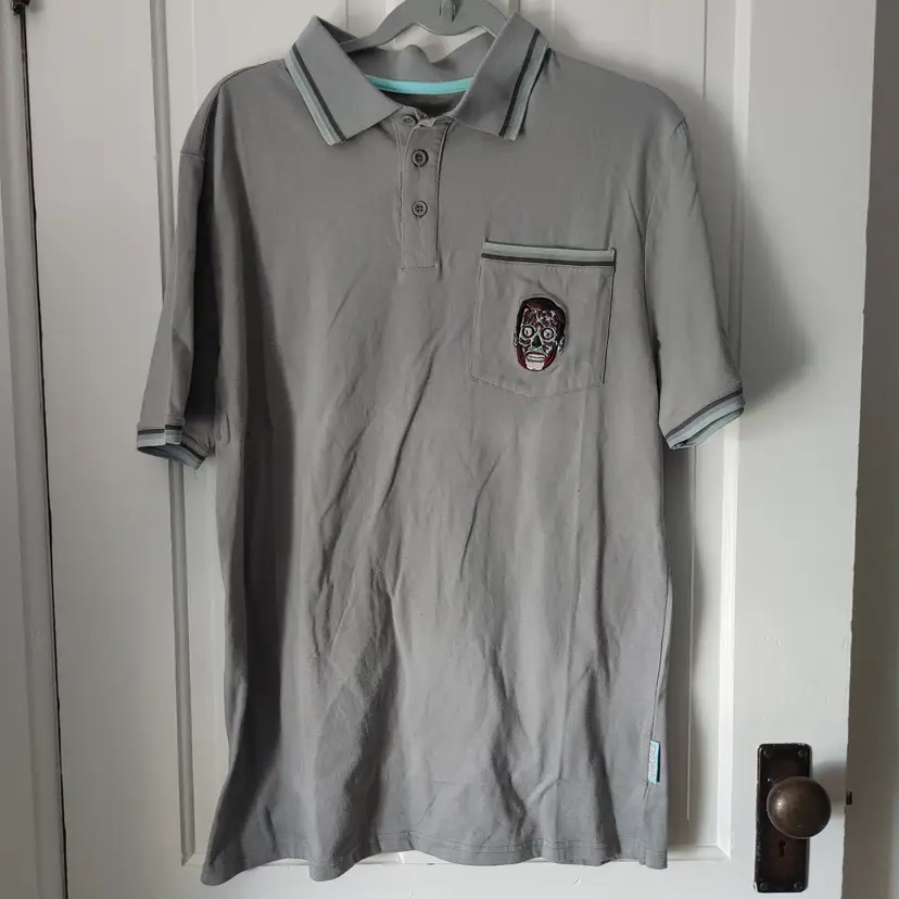 Men's Top- Brand: They Live. Size XL. Grey top with skull. Material: 60% cotton, 40% polyester. No condition issues.