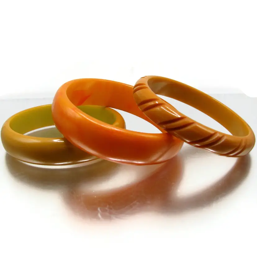 3 Bakelite Bangles One Carved