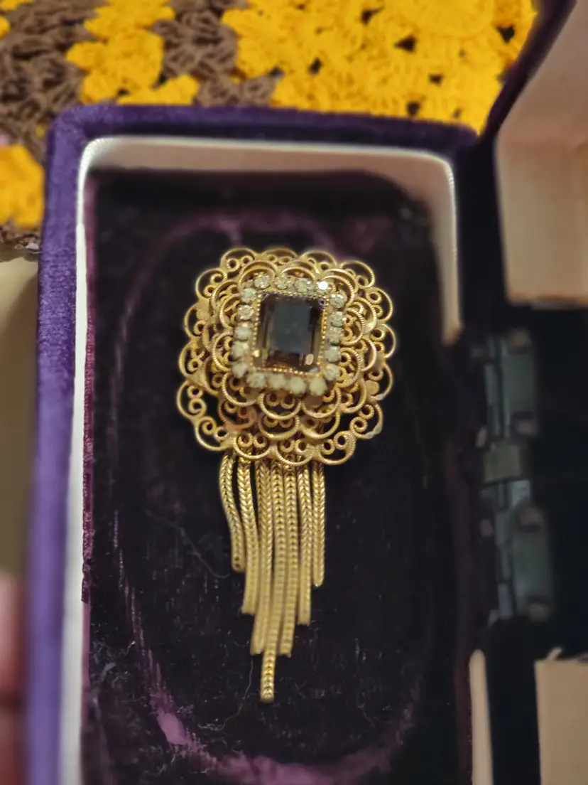 Vintage mid-century Hobé convertible brooch and pendant featuring an intricate layered design.