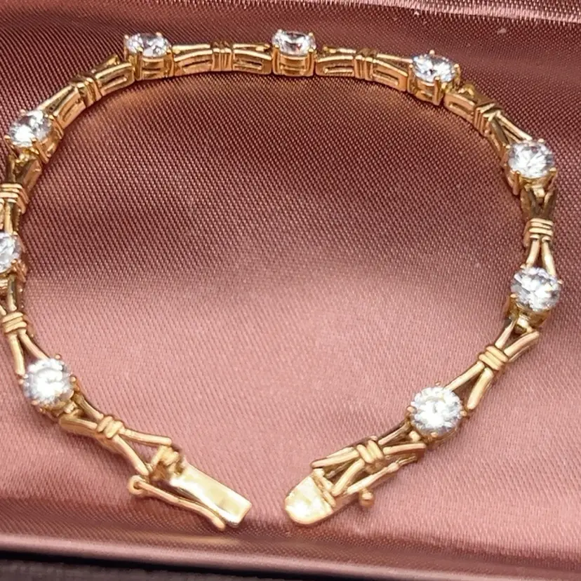 Vintage 1980s ROMAN 7” Gold Tone Rhinestone Bow Link Tennis Bracelet