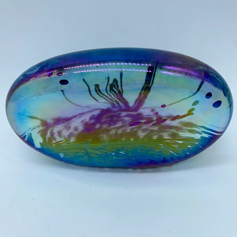 #0034 A signed Glasform iridescent art glass paperweight with internal Abstract floral design.