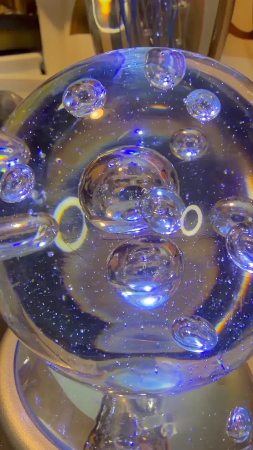 #34… This Paperweight is 2½ inches tall and 2 inches across the base, with lots of pretty bubbles suspended in clear glass