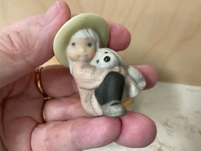 1998 a cuddly holiday hug little girl with dog collectible by Kim Anderson