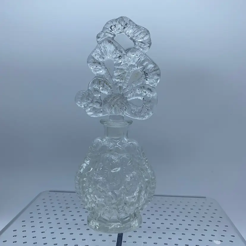 #4219 Vintage clear pressed glass perfume bottle with a decorative fan stopper.