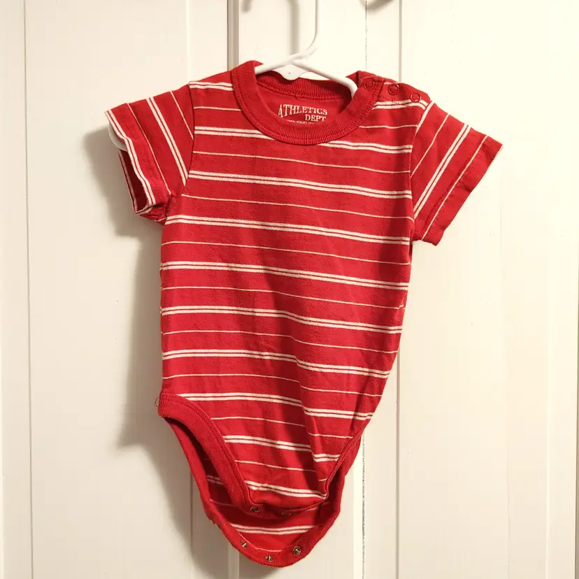 Kids- Brand: Athletics Dept Place. Size 12 months. Red striped onesie. Material- 100% cotton. No callouts.