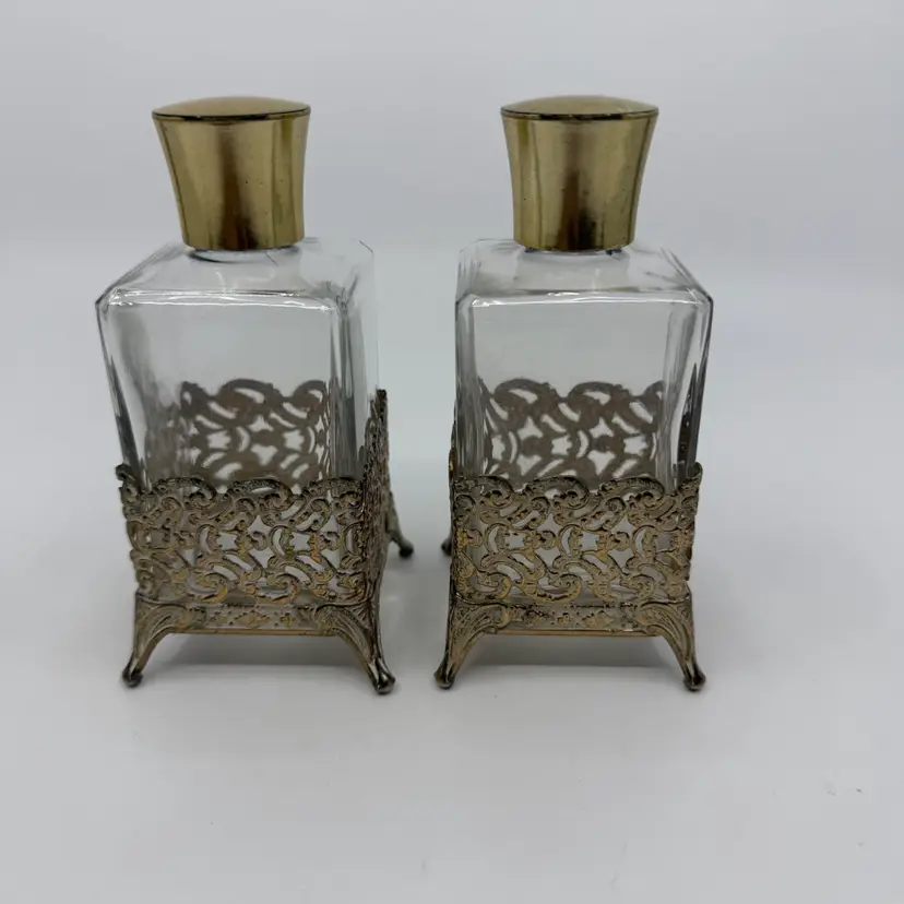 2 Vintage Hollywood Regency Gold Metal Filigree Footed Sleeve Over Clear Glass Perfume Bottles 4.75”