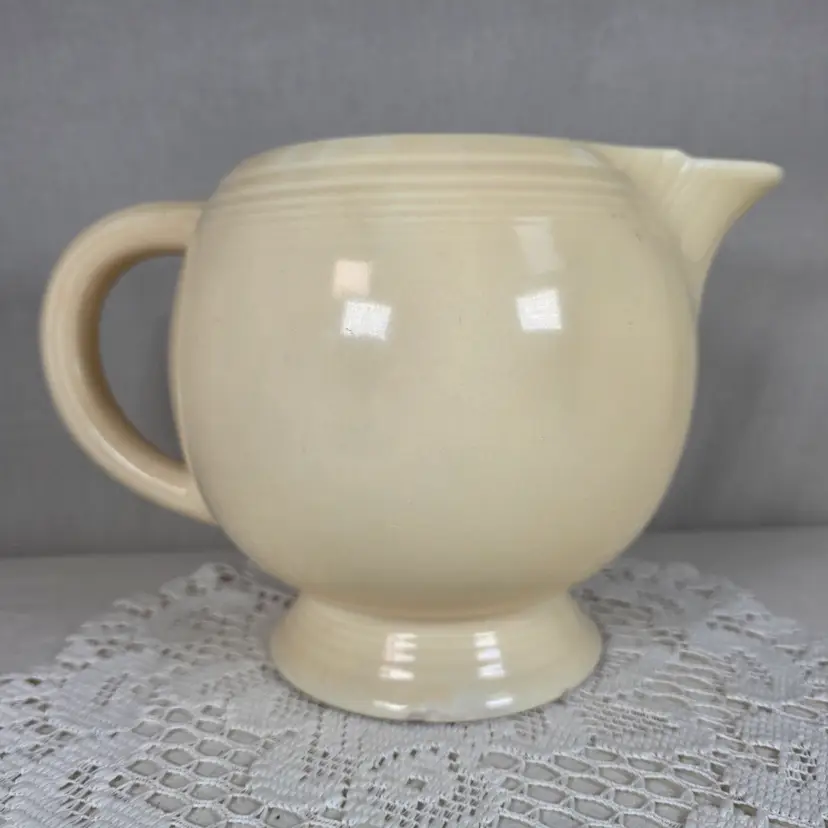 Vintage Fiesta Ivory Ice Lip Pitcher 9 1/2" Wide 7" Tall With Minor Chips On Base Edge
