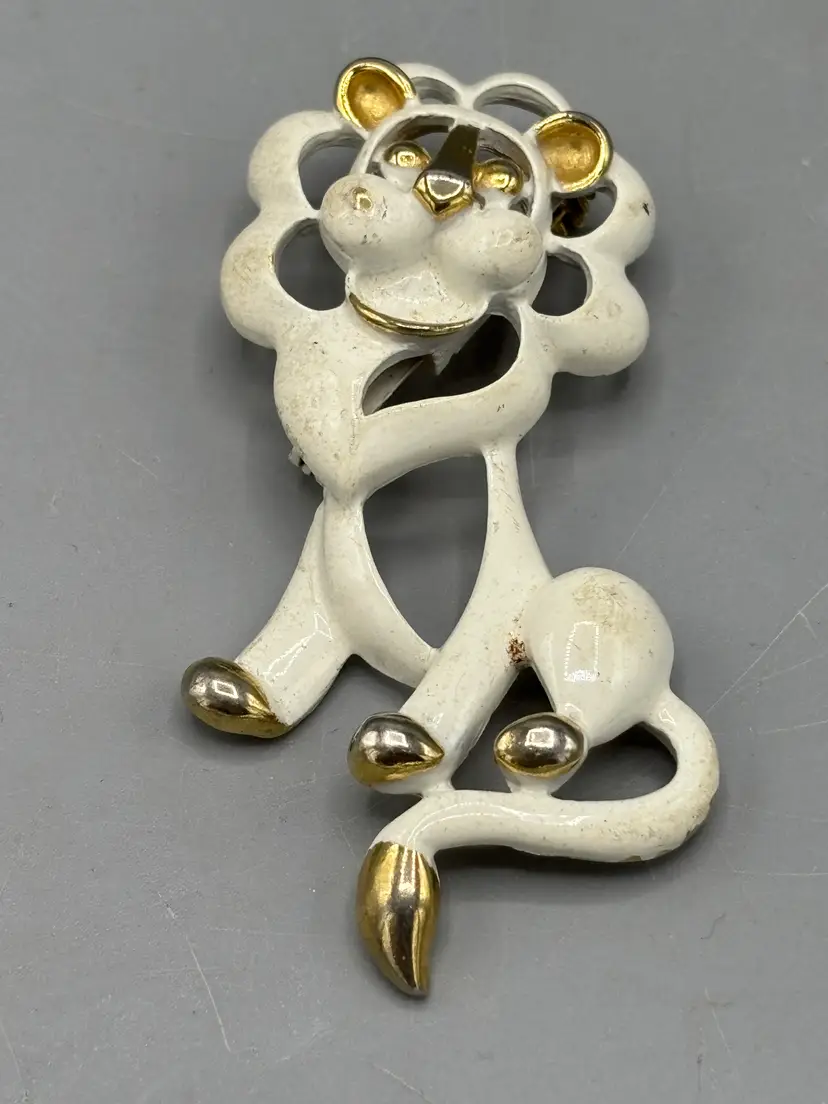 Gold tone Cream enamel Lion brooch