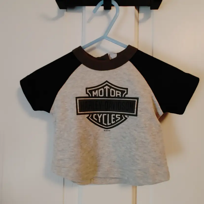 Kids- Brand: Harley Davidson. Size 0-3 months. T-shirt. Material- 60% cotton, 40% polyester. No callouts.