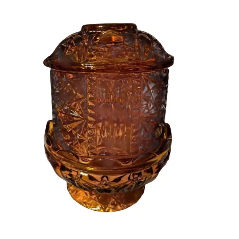 Vintage amber glass fairy lamp in the "Stars and Bars" pattern, produced by the Indiana Glass Company