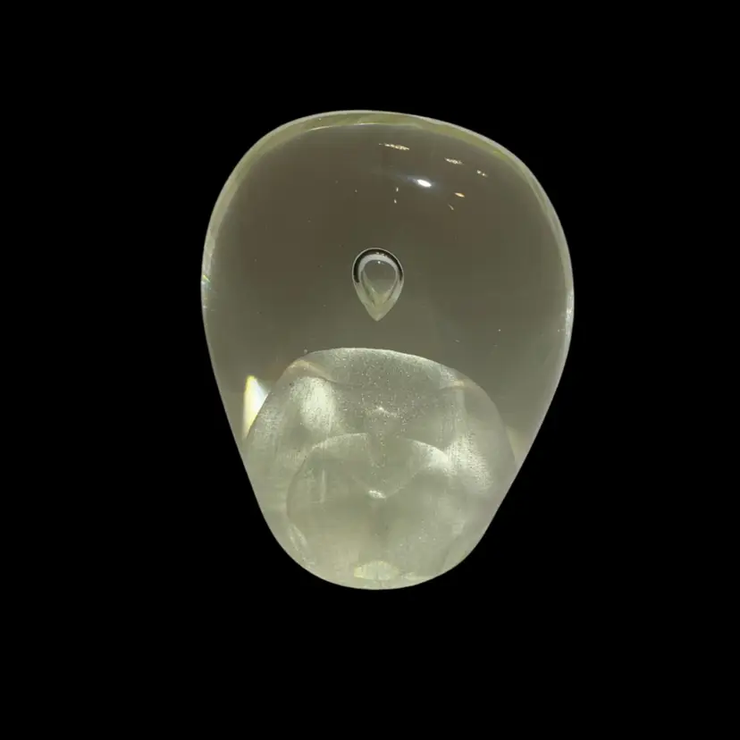 Clear Glass Kernel Shaped Paperweight With Iridescent Form With 1 Large Air Bubbly Floating Above