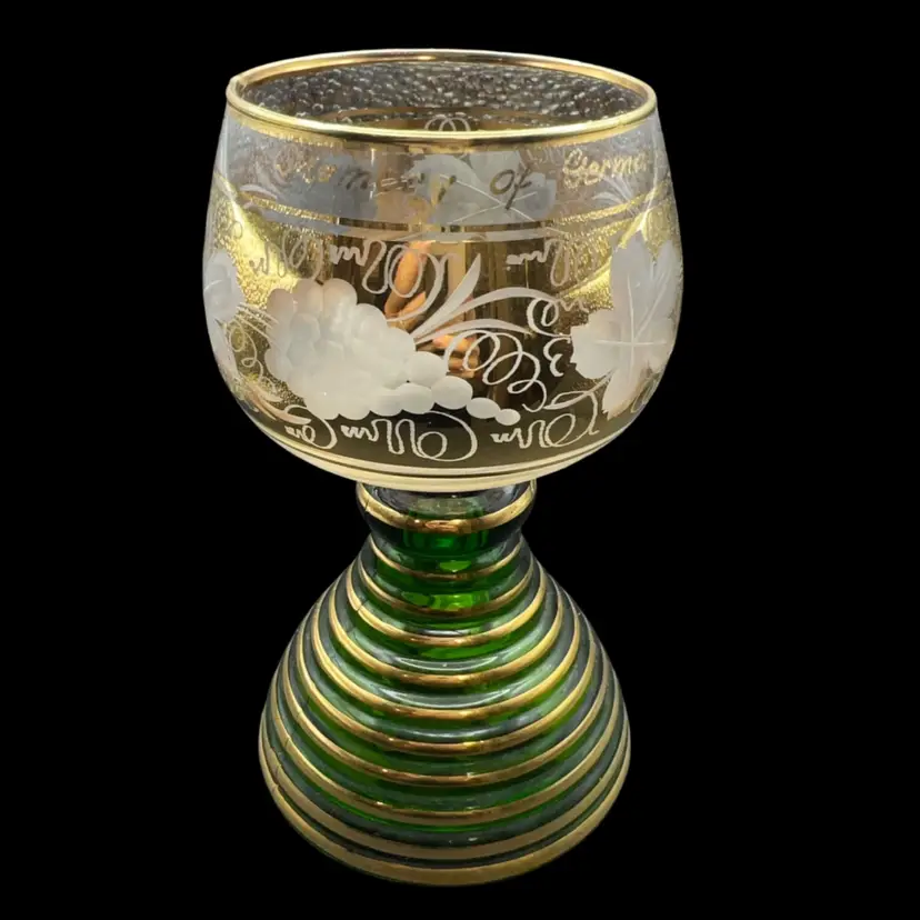 German Romer wine glass goblet featuring a green ribbed beehive stem with gold trim and etched grape and leaf designs on the clear bowl Bonus! Music Box In Base 1973
