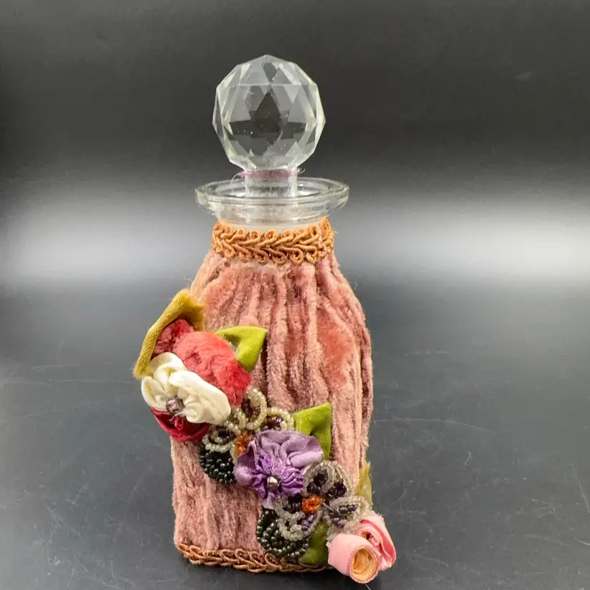 Perfume Bottle With Beaded Embellishments And Floral Design Has A Victorian Look